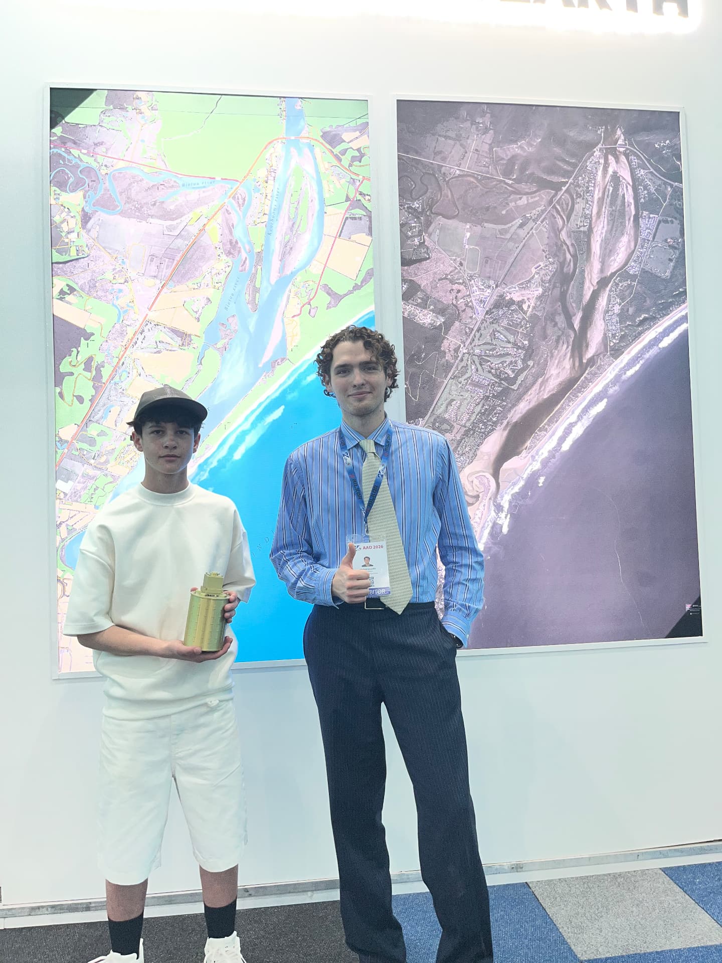 Sustaino-1 TubeSat model with an exhibitor at AAD 2026