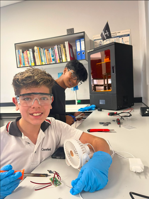 EAK-Orbitals engineers beside the resin 3D printer during a build session