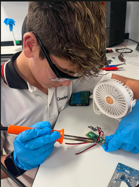Soldering the power harness for a Sustaino-1 subsystem